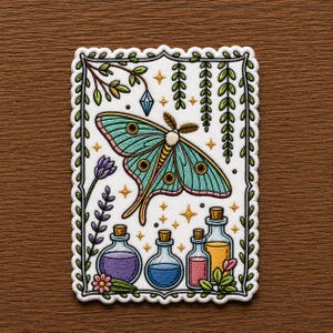 May include: Embroidered patch featuring a large teal moth with pink accents, surrounded by botanical elements and potion bottles. The design includes a lavender sprig, hanging vines, and a crystal. The patch has a scalloped border.