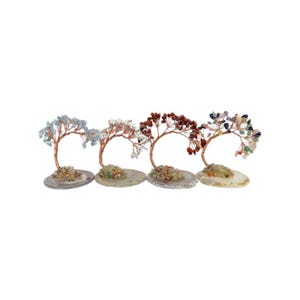 May include: Four gemstone trees with copper wire branches and colourful stone leaves. Each tree sits on a small, oval stone base. The trees feature blue, white, red, and multicoloured gemstones.