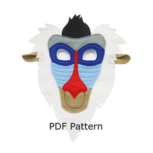 May include: A felt mask of Rafiki from The Lion King. The mask is white with a brown nose, red lips, blue eyes, and a black mane. The text "PDF Pattern" is printed below the mask.
