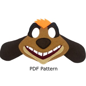 Könnte beinhalten: Filzmaske eines braunen und orangefarbenen Tieres mit einem großen Lächeln und braunen Ohren. Die Maske hat Augenlöcher und eine Nase. Der Text "PDF Pattern" befindet sich unter der Maske.