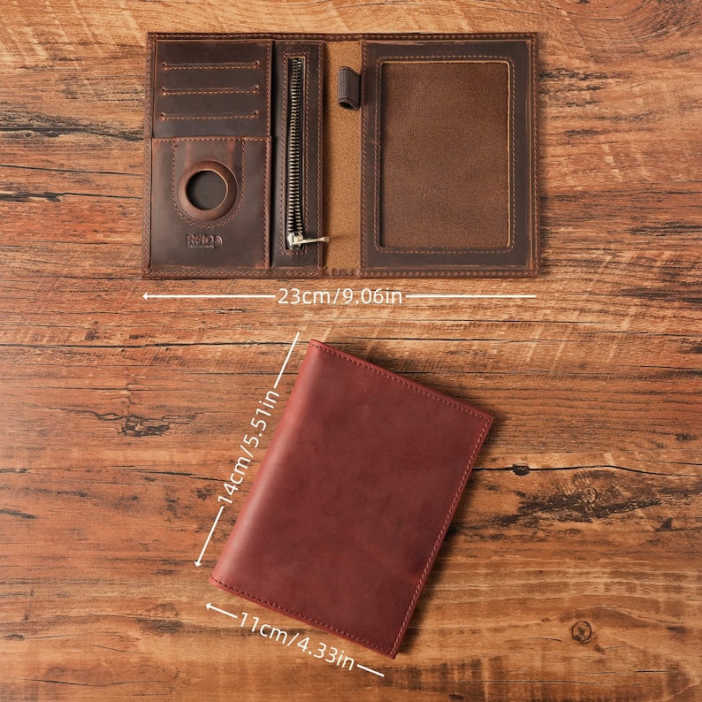 May include: A brown leather passport holder measuring 9.06 inches wide when open, with a closed height of 5.51 inches and width of 4.33 inches. The interior features card slots, a circular cutout, a zippered pocket, and a clear ID window.