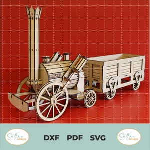 Op de afbeelding: Een houten model van de stoomlocomotief Rocket, een historische locomotief. Het model is gedetailleerd met een schoorsteen, wielen en een wagen. Het model is gelabeld met "ROCKET" en is klaar om in elkaar te worden gezet.