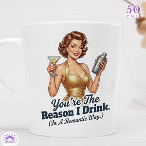 May include: White ceramic mug featuring a retro illustration of a woman in a gold dress holding a martini and a cocktail shaker. The mug has the text "You're The Reason I Drink. (In A Romantic Way.)" printed on it.