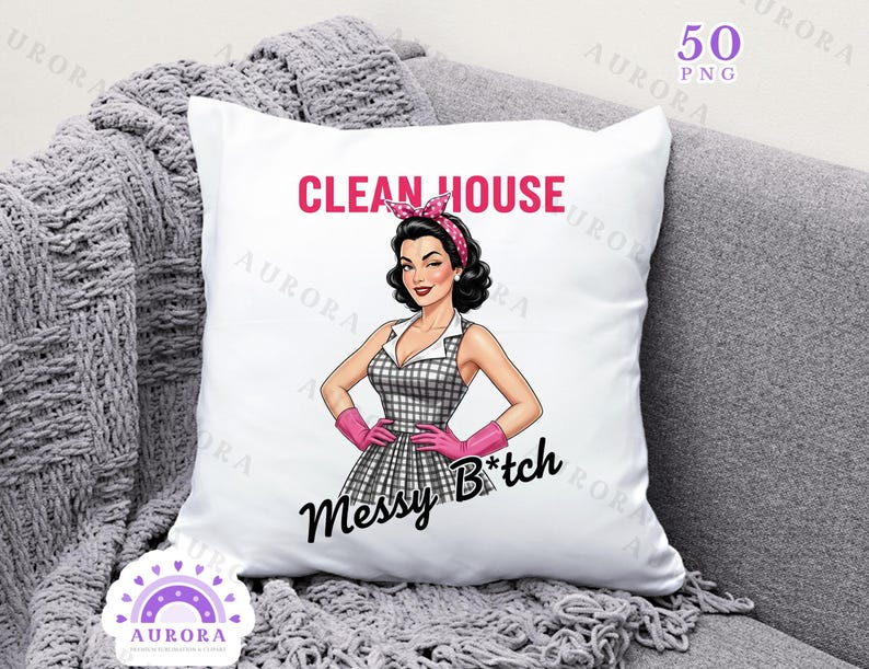 May include: White square pillow with a retro illustration of a woman in a checkered dress, pink gloves, and a headband. Text reads "CLEAN HOUSE" in pink and "Messy B*tch" in black. The pillow is on a gray couch.