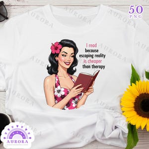 May include: White t-shirt featuring a retro illustration of a woman reading a book. The woman is wearing a pink floral dress and a flower in her hair. Text on the shirt reads: "I read because escaping reality is cheaper than therapy."