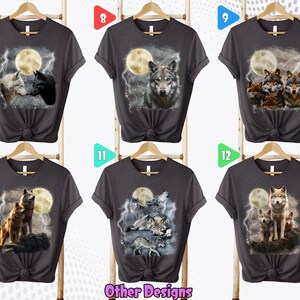 K&ouml;nnte beinhalten: Zehn verschiedene Designs von grauen T-Shirts mit Wolfs-Illustrationen mit Vollmond und Blitzen. Die Designs beinhalten ein Wolfspaar, einen einsamen Wolf und einen Wolfsrudel.