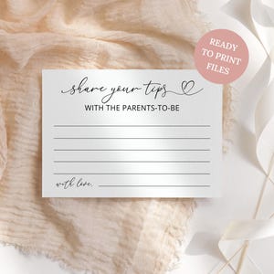 May include: A white card with the text "share your tips with the parents-to-be" in elegant script. The card has horizontal lines for writing and the words "with love" at the bottom. A pink circle with the text "READY TO PRINT FILES" is in the upper right corner.