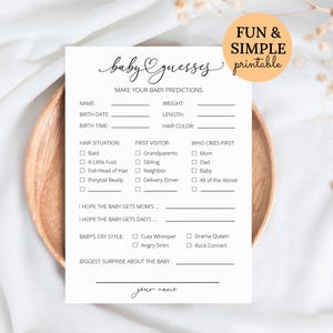 May include: A white baby shower game card with the text "baby guesses" in cursive script. The card includes fill-in-the-blank sections for predictions about the baby's name, weight, and hair colour. A fun and simple printable.