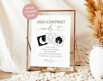 May include: A white sign in a copper frame with black text reading HIGH CONTRAST cards, instructions to make a card using a black marker, sign your name, and create a sweet keepsake that baby will love to look at, with a thank you at the bottom.