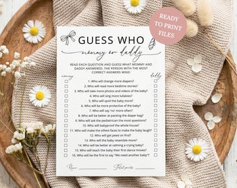 May include: A white rectangular paper game card titled Guess Who Mommy or Daddy with black text and line drawings of a bow and tie. The card lists sixteen questions about parenting with checkboxes for mommy and daddy, plus name and total points lines.