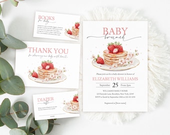 May include: Baby shower invitation with a pink and white color scheme. The invitation features a watercolor illustration of a stack of pancakes with strawberries and a pink floral design. The text on the invitation reads "Baby Brunch" and includes the name "Elizabeth Williams", the date "September 25", and the time "From 2pm".