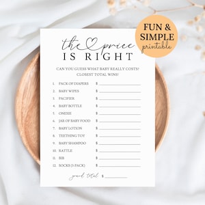 May include: A black and white printable baby shower game card titled "The Price is Right." The game card includes a list of baby items with blank spaces for prices. A circular orange sticker reads "Fun & Simple printable."