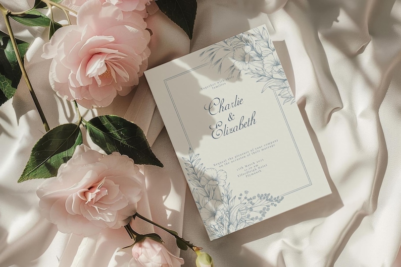 Beautiful wedding invitation mockup highlighted by blue line art floral accents.