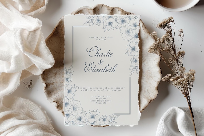 Beautiful wedding invitation mockup highlighted by blue line art floral accents.