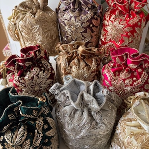 May include: A set of three ceramic mugs with a speckled, matte finish in cream, light grey, and dark grey. Each mug has a simple, minimalist design, suitable for coffee or tea.