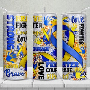 May include: A stainless steel tumbler with a design featuring blue and yellow ribbons, handprints, and the words "Strong," "Brave," "Fighter," "Courage," and "Love." The tumbler has a silver lid and a straw.