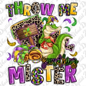 May include: A green alligator wearing a jester's hat holds a red crawfish. The alligator is surrounded by Mardi Gras themed items, including a purple, green and gold sign with a fleur-de-lis, a purple, green and gold beaded necklace, and a purple, green and gold king cake. The text "THROW ME SOMETHING MISTER" is written in purple, green and gold glitter letters.
