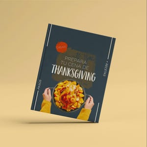May include: A cookbook with a dark blue cover featuring the text "Prepara Tu Cena De Thanksgiving". The image shows a roasted chicken surrounded by potatoes in a black pan. The cookbook has white vertical lines on the left and right sides.