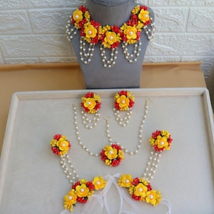 red yellow haldi floral jewelry   yellow red floral jewelry   bridal floral jewelry  mehendi floral jewelry   floral jewelry for haldi