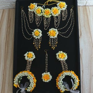 yellow haldi floral jewelry   yellow white floral jewelry   bridal floral jewelry