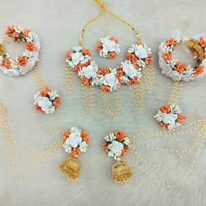 Floral white and orange jewelry for haldi   haldi floral jewelry   orange white floral jewelry   jewelry for haldi   jewelry for mehendi