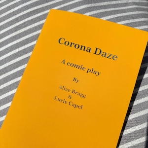 May include: A yellow book with the title "Corona Daze: A comic play" by Alice Bragg & Lucie Capel.