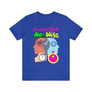 May include: A royal blue t-shirt with a graphic design of two heads with a clock and the text "CounterClock No! Wise".