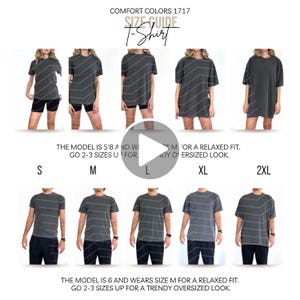 Könnte beinhalten: Größentabelle für Comfort Colors 1717 T-Shirts. Das Bild zeigt Models, die graue T-Shirts in den Größen S, M, L, XL und 2XL tragen. Der Text gibt an, dass das Model 1,73 m groß ist und Größe M für eine lockere Passform trägt.