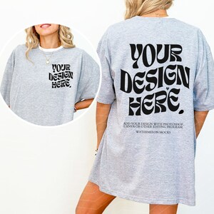 May include: Gray oversized t-shirt mockup with the text "YOUR DESIGN HERE" in a retro font on the back.  Add your own design to this mockup using Photoshop, Canva, or other editing programs.