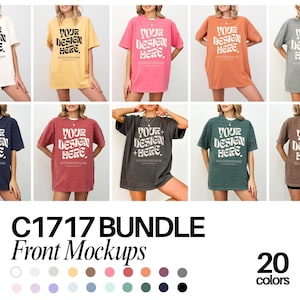 Puede incluir: Una maqueta de 20 camisetas de gran tamaño de diferentes colores con el texto "YOUR DESIGN HERE" impreso en la parte delantera. Las camisetas se muestran en modelos frente a un fondo blanco. C1717 BUNDLE Maquetas frontales 20 colores