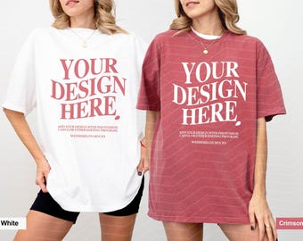 May include: Two oversized t-shirts, one white and one crimson, each featuring the text YOUR DESIGN HERE in a large serif font. Below the main text, smaller print reads ADD YOUR DESIGN WITH PHOTOSHOP, CANVA OR OTHER EDITING PROGRAM, WATERMELON MOCKS.