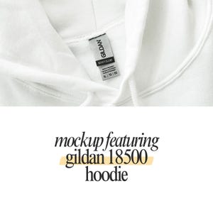 a close up of a white hoodie with a tag on it