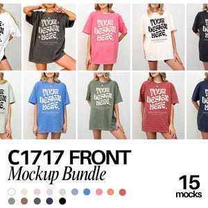 May include: A collection of ten short-sleeve t-shirts in various solid colors, each featuring the bold black text 'YOUR DESIGN HERE' in a wavy font style. The shirts are displayed in a grid layout, showcasing different color options including white, charcoal, pink, cream, black, light gray, blue, olive, red, and navy.