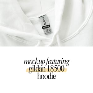 a close up of a white hoodie with a tag on it