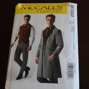 May include: McCall's Costumes M7003 sewing pattern for men's formal wear. The pattern features illustrations of a long coat and vest with trousers. The packaging is white and yellow with the text "MEN" and "Designed and printed in USA."