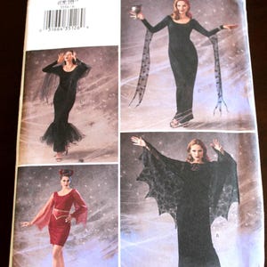 May include: A sewing pattern for a witch costume. The pattern includes four different styles of dresses with long sleeves and flowing capes. The pattern number is 3554.