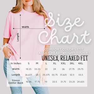 May include: A light pink unisex t-shirt with a size chart overlay. The chart lists measurements in inches for width, length, and sleeve center back for sizes S through 4XL. The shirt is Comfort Colors 1717, adult heavyweight, and relaxed fit.