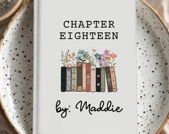 May include: A white book cover with the text "CHAPTER EIGHTEEN" in black. Below the text is a row of illustrated books with colorful flowers on top. The words "by: Maddie" are written in cursive below the books.