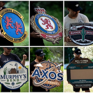May include: A collection of six custom-made wooden signs featuring various designs, including military emblems, university logos, travel branding, and commemorative plaques with text such as Sustaining Surety, Luchtmacht, Banner Desert, Murphy's Bend, Axos Travel, and Bill Climer Wall of Fame.