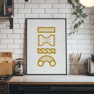 May include: A black framed print with a white background and gold illustrations of different types of pasta. The pasta shapes include a bowtie, a long noodle, a short noodle, and a spiral noodle.