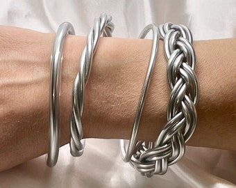 Fine twisted braided Buddhist bangle cheap trendy silver color fashionable bangle bracelet water resistant Buddhist bangles