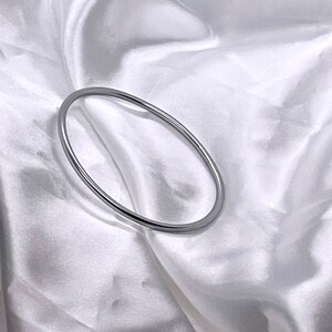 Fine twisted braided Buddhist bangle cheap trendy silver color fashionable bangle bracelet water resistant Buddhist bangles Jonc très fin