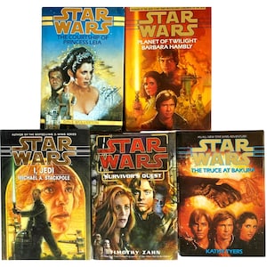 May include: A collection of five Star Wars novels. The book covers feature illustrations of characters and scenes from the Star Wars universe. Titles include "The Courtship of Princess Leia" and "Planet of Twilight."