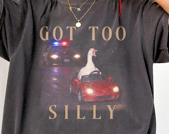 Silly goose leads police chase Comfort Colors shirt, funny goose meme outfit, geese lover gift, unhinged graphic tee, goose girl tan top