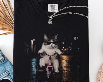 We ride at dawn Comfort Colors shirt, cat riding a tricycle at night tee, unhinged cat mom gift, kitty meme outfit, biking mom tank top