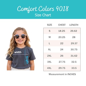 May include: Comfort Colors 9018 size chart featuring a child wearing a dark gray t-shirt with width and length indicators. A table lists sizes S through 4XL with corresponding chest and length measurements in inches, ranging from 18.25 to 33.5 inches.