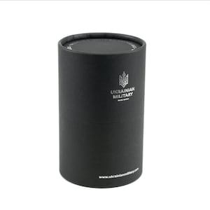 May include: A black cylindrical box with a silver logo that says "UKRAINIAN MILITARY SWISS WATCH" and the website address "www.ukrainianmilitary.com".