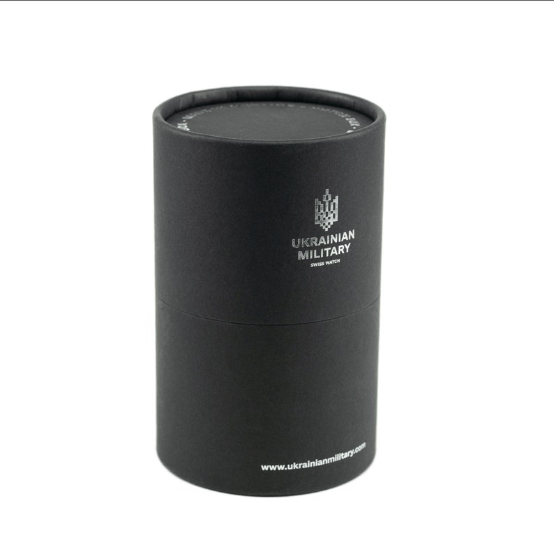 May include: A black cylindrical box with a silver logo that says "UKRAINIAN MILITARY SWISS WATCH" and the website address "www.ukrainianmilitary.com".