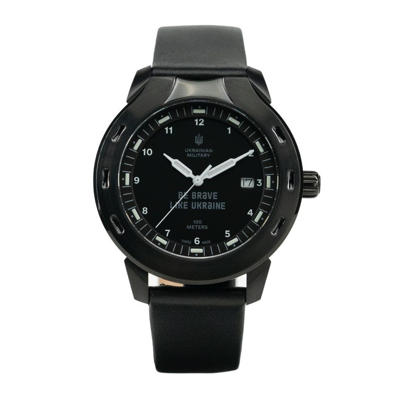 May include: A black wristwatch with a black leather band. The watch face is black with white markings and the text "BE BRAVE LIKE UKRAINE" and "UKRAINIAN MILITARY".
