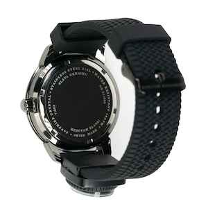 May include: Black wristwatch with a black rubber band. The back of the watch has the text "SLAVA UKRAINI!" and "HEROYAM SLAVA!" in white lettering. The watch is water resistant to 10 ATM.